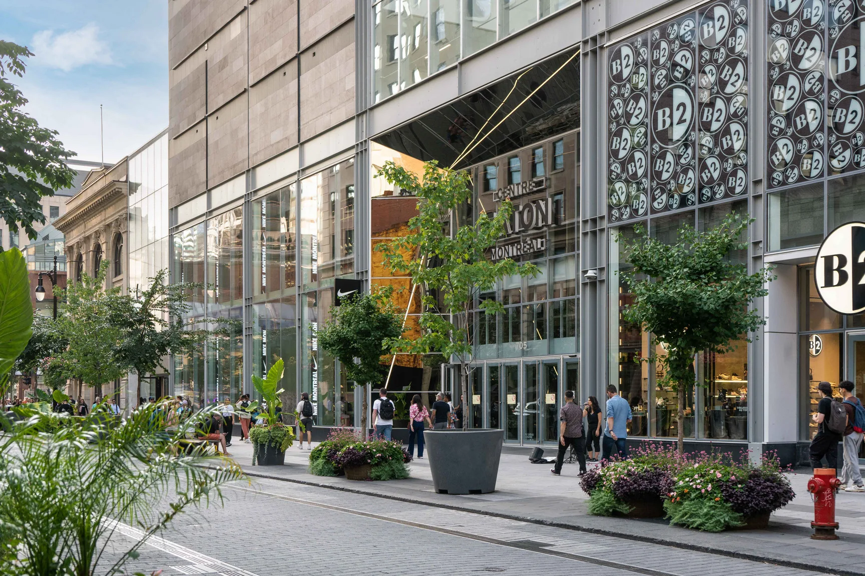 Pedestrians and storefronts on a Montreal commercial street